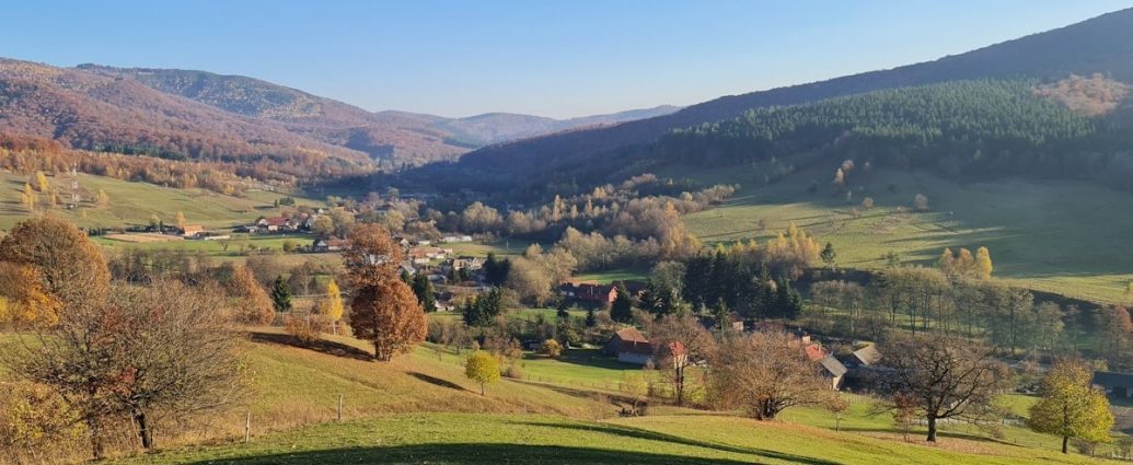 a scenic view of a valley in the mountains